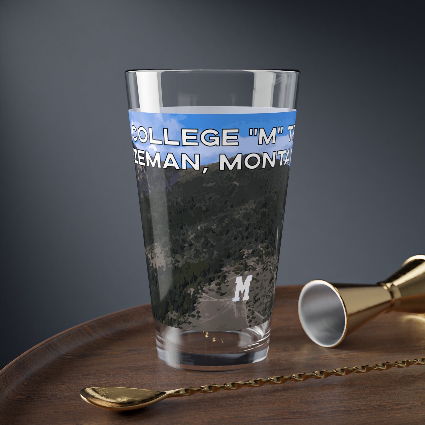 Front view of The College "M" Trail in Bozeman, Montana 16oz Beer Glass from Park Attire